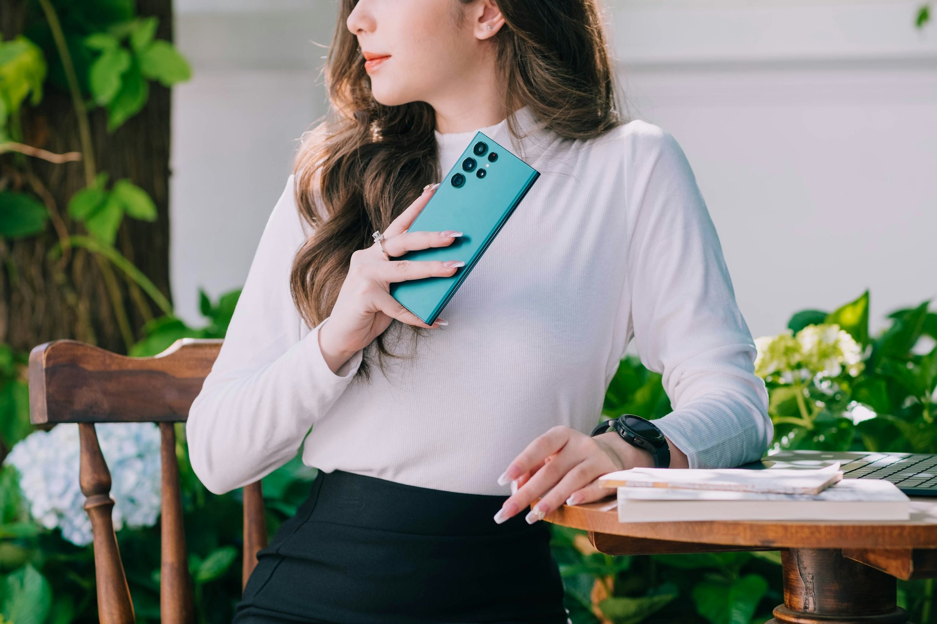 A woman looks at a tablet